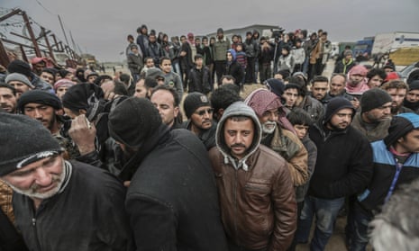 Syrians gather at the Bab al-Salam border gate with Turkey