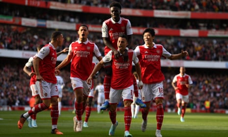 Arsenal players celebrate Gabriel Martinelli’s opener against Liverpool.