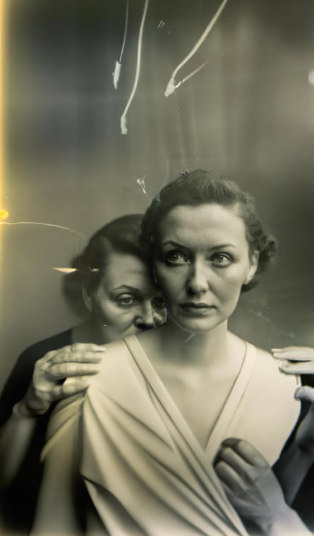 Sepia image of two women, one crouched behind the other, in an image that it turned out later was produced by AI