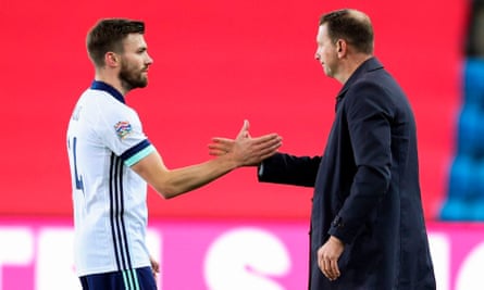 Stuart Dallas (left) with Northern Ireland manager Ian Baraclough after the game in which the Leeds defender scored an unfortunate own goal.
