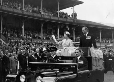 Queen Elizabeth II and Prince Philip wave to crowds on 25 February as they are driven on a circuit of Melbourne Cricket Ground during their 1954 Australian tour.