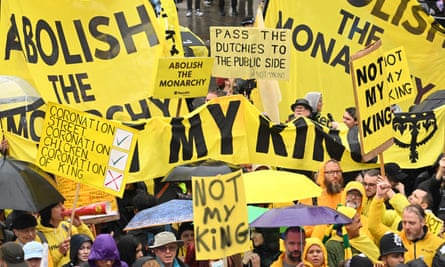 Protesters holding anti-monarchy banners and signs with messages including ‘Not my king’ and ‘Abolish the monarch’