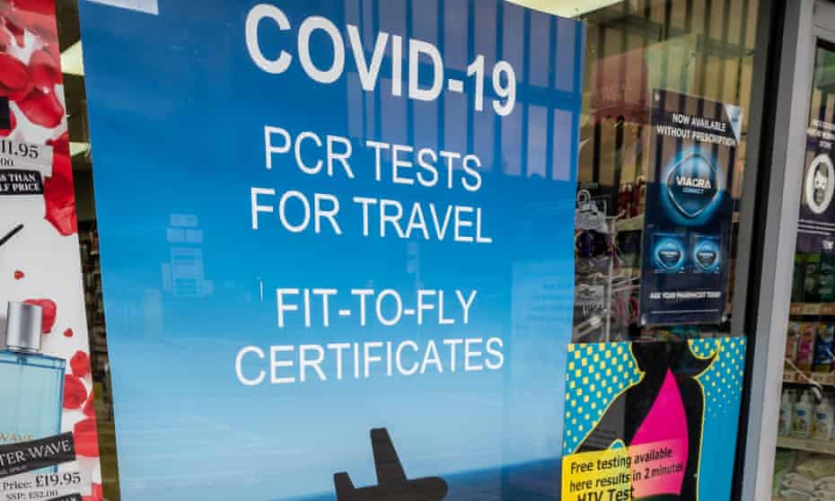 A poster at a pharmacy offering a PCR Covid test for travel
