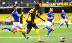 Ismaila Sarr of Watford goes past Ben Chilwell of Leicester City.