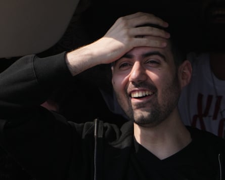 Guy Gilboa-Dalal looking happy and overwhelmed, with his hand to his forehead
