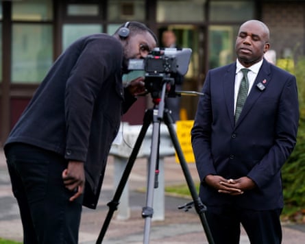 David Lammy being filmed outside by a cameraman