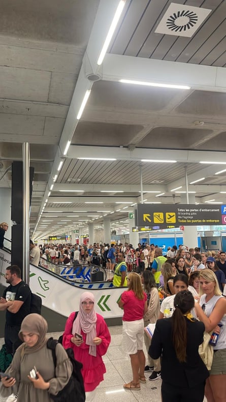 People queuing to rebook their flights at Palma airport on Monday.