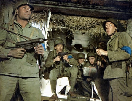 Jim Brown, left, and Donald Sutherland, far right, in The Dirty Dozen, 1967. Brown left the Cleveland Browns during the making of the film.