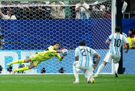 Argentina's Lionel Messi (right) has a penalty saved by Egypt goalkeeper Mohamed Shobeir.