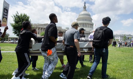 The Poor People’s Campaign protest on Capitol Hill by transporting an empty casket symbolizing people who have died from lack of healthcare on 4 June.