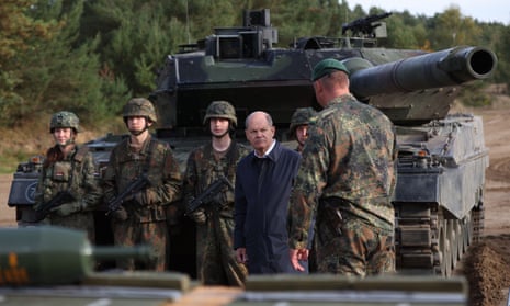 Olaf Scholz with a Leopard 2 tank.