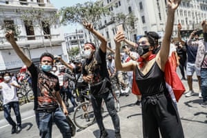 Protesters celebrate the resignation of Manuel Merino