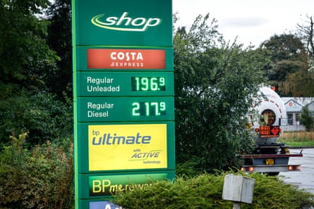 Sign at a BP service station indicating a diesel price of £2.17 a litre. A fuel tanker is leaving the forecourt in the background.