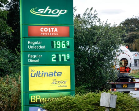 Sign at a BP service station indicating a diesel price of £2.17 a litre. A fuel tanker is leaving the forecourt in the background.