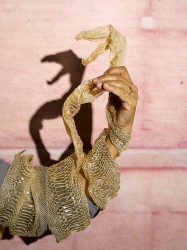 Snake skin around a woman’s arm