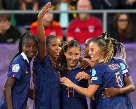 Clara Mateo of France celebrates with teammates after scoring her team's first goal against Wales.