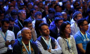 Attendees watch the opening keynote at the F8 conference.