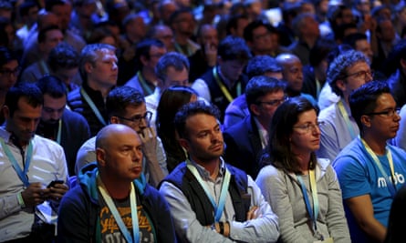 Attendees watch the opening keynote at the F8 conference.