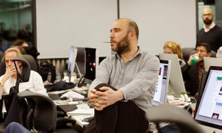 Former Guardian national news editor Dan Sabbagh sitting in the newsroom listening to other journalists