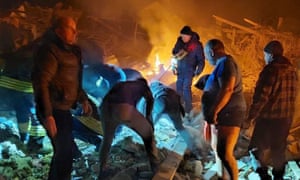 Rescuers working among the rubble of private houses, which is said were destroyed by a Russian airstrike, in Zhytomyr on March 1, 2022.