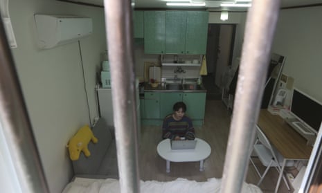 A Seoul resident in her semi-basement apartment.