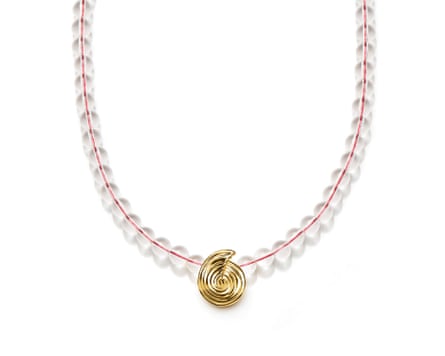 A gemstone beaded necklace with a gold spiral pendant