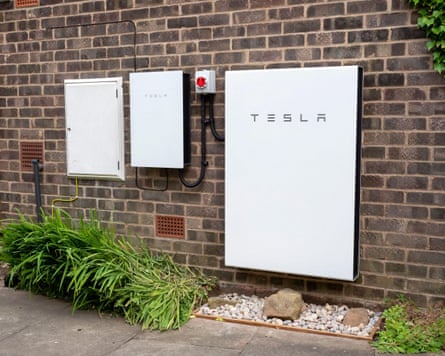 Tesla Powerwall 2 and Backup Gateway 2 battery storage system installed on a brick house wall