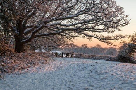 Snow covered High Weald landscape at sunrise, Burwash, East Sussex, England