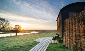 One of Elmley nature reserve’s six huts, which offer wetland views, Kent, UK.