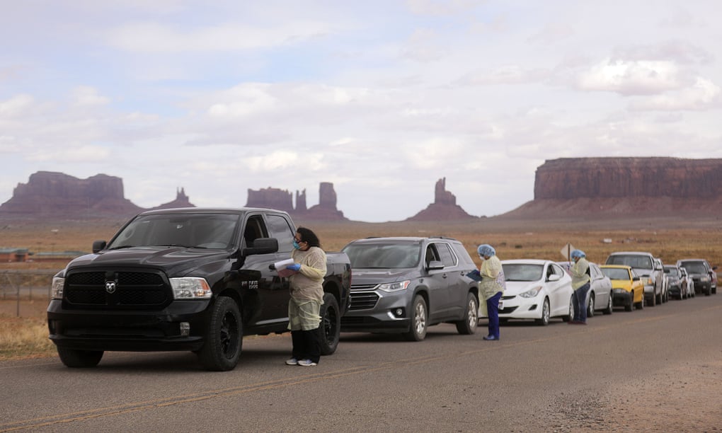 People lined up to get tested for Covid-19 outside of the center in Oljato-Monument Valley, San Juan county, Utah. Photograph: Kristin Murphy/AP 