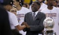 Golden State Warriors guard Stephen Curry, left, shakes hands with former coach Al Attles during a 2015 playoff game.