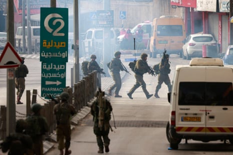 Israeli troops raid the Al-Amari refugee camp near Ramallah, in the Israeli-occupied West Bank, on 4 March.