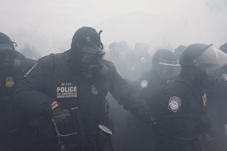 U.S. Customs and Border Protection (CBP) agents face protesters during a demonstration outside the Whipple Federal Building, more than a week after a U.S. Immigration and Customs Enforcement (ICE) agent fatally shot Renee Nicole Good on January 7, in Minneapolis, Minnesota, U.S.