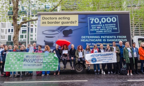 Protesters with a Doctors of the World vehicle spoofing the Home Office ‘go home’ van