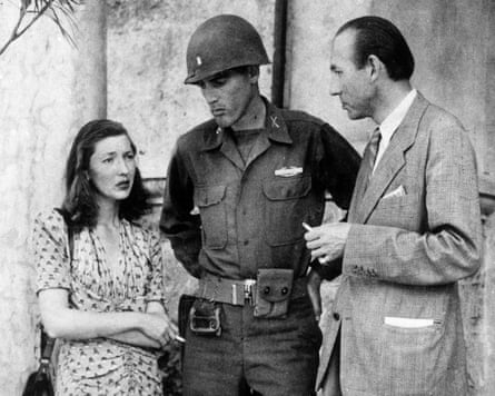 Jean Luchaire and his daughter Corinne stand either side of an allied soldier in this black and white photograph