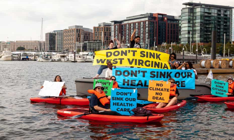 Demonstrators in boats and kayaks protest near Senator Joe Manchin's houseboat in the Washington marina in September. 