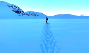 This shot is of our ski guide, Simon, herringbone-walking across pristine snow covering a high alpine pond, the morning of an epic freeride tour day in January, in the Silvretta Montafon resort in Austria.