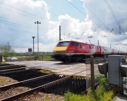 red-liveried locomotive approaches