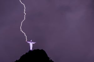 Rio de Janeiro, Brazil. Lightning hits the hand of the Christ the Redeemer statue on Corcovado mountain