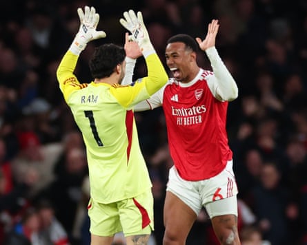 Gabriel Magalhães and David Raya celebrate after beating Everton.