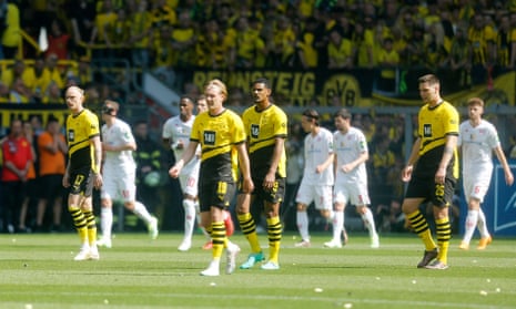 Borussia Dortmund's Sebastien Haller and teammates look dejected after Mainz's Andreas Hanche-Olsen opened the scoring.