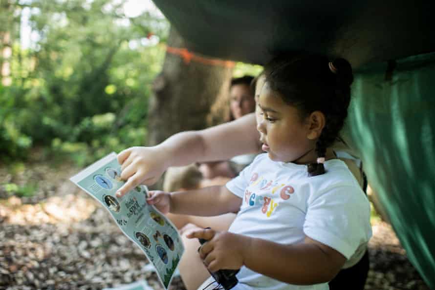 A child birdwatching in one of the royal parks