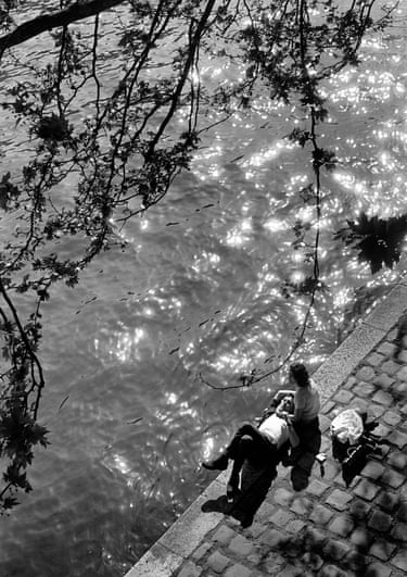 Couple relaxing on the bank of the Seine near Notre Dame cathedral, Paris, 1963The magazine was not solely devoted to news. Their feature, ‘Life goes to a … ’, reflected ordinary readers’ everyday lives – covering everything from high-school graduations to debutante parties