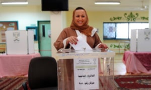 A woman casts her ballot in Jeddah on 12 December in the first Saudi elections to allow women to vote.