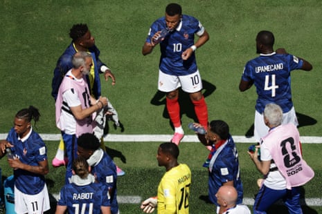 Kylian Mbappe and his French teammates take on some hydration.