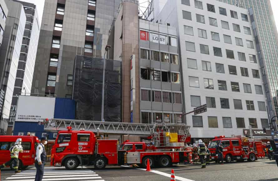 Firefighters at the building where the fire broke out in Osaka.