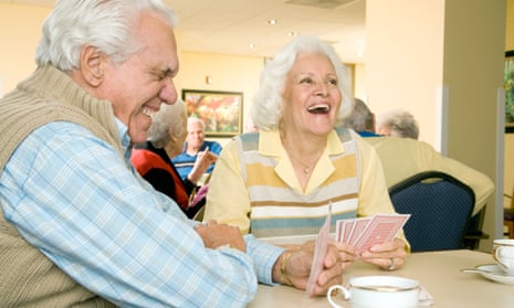 Two residents in a retirement home playing cards