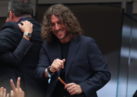Former Spain international Carles Puyol smiles from the balcony prior to the Spain-Austria match.,