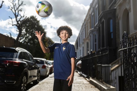 England’s united nations of football: 32 teams, one World Cup – and a lot of excited kids | World Cup 2022 16 Adam Tounsi standing in a residential street wearing the France kit and throwing a football in the air