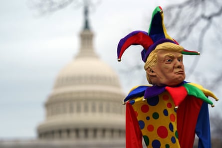 doll of trump dressed as jester, outside capitol building